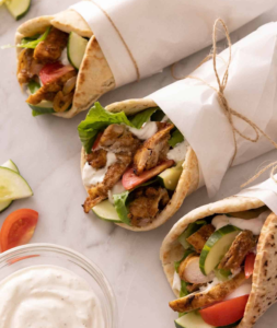 chicken shawarma,lettuce,onions,tomatoes,garlic sauce & hot sauce. Additional Toppings Available: